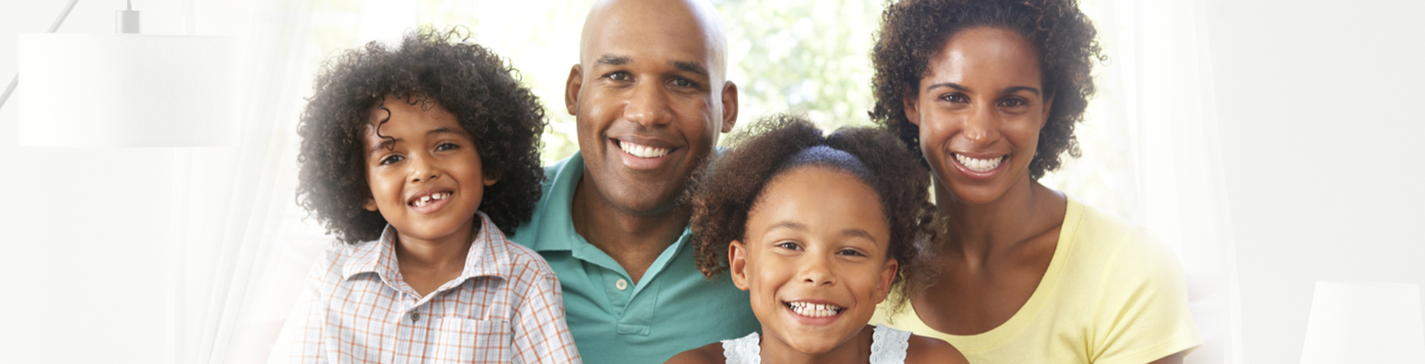 Portrait of mother, father and two children smiling